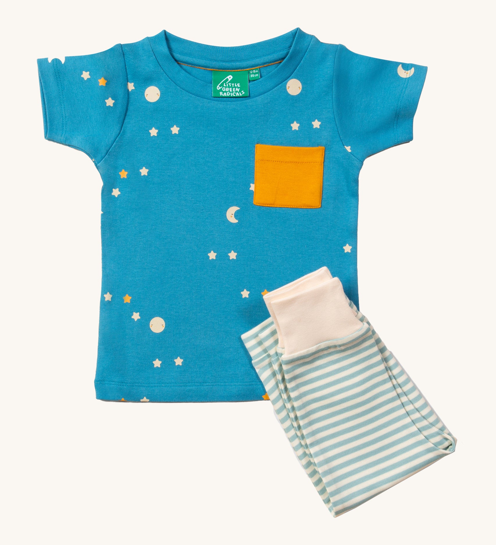 LGR Dawn Organic T-Shirt & Jogger Playset, with a light blue fabric top with moons and stars print and a yellow pocket, and light green and white stripe bottoms