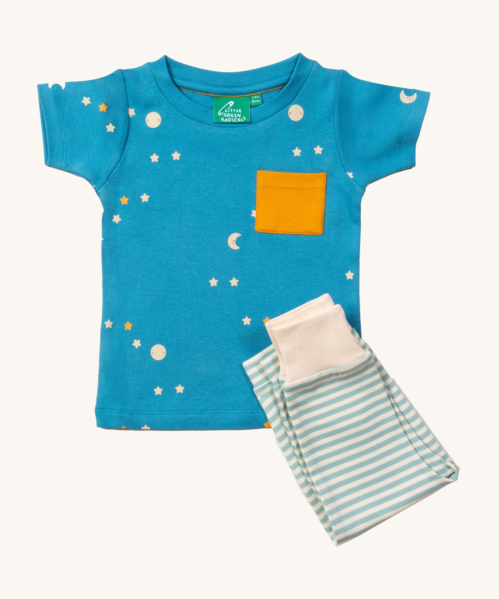 LGR Dawn Organic T-Shirt & Jogger Playset, with a light blue fabric top with moons and stars print and a yellow pocket, and light green and white stripe bottoms