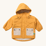 Little Green Radicals gold recycled plastic rain coat on a cream background