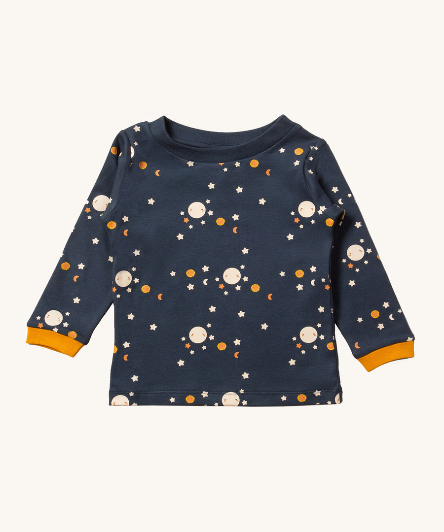 A beautiful midnight blue colour, long sleeve top with a moon and stars pattern, and mustard yellow sleeve cuffs