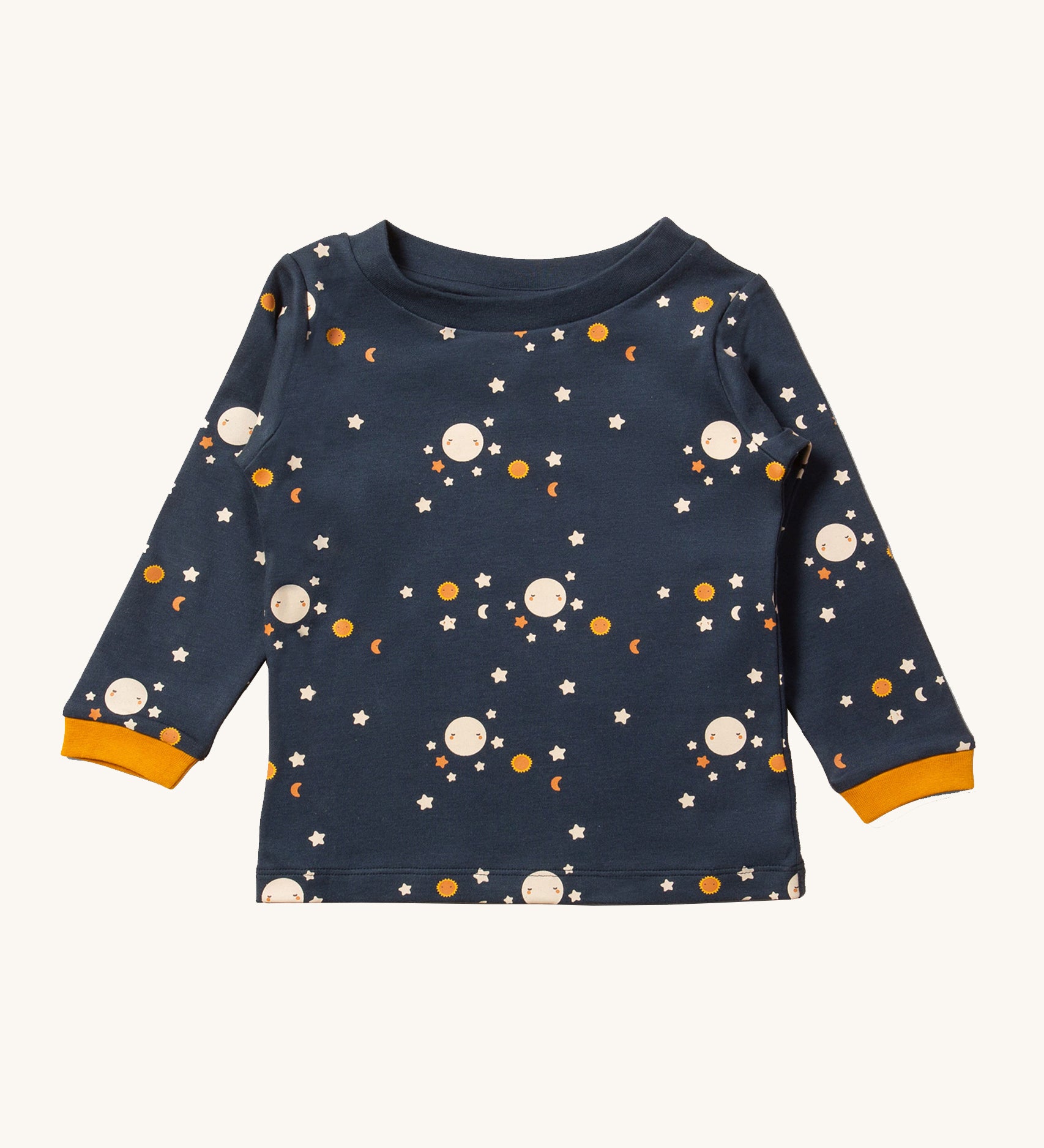 A beautiful midnight blue colour, long sleeve top with a moon and stars pattern, and mustard yellow sleeve cuffs