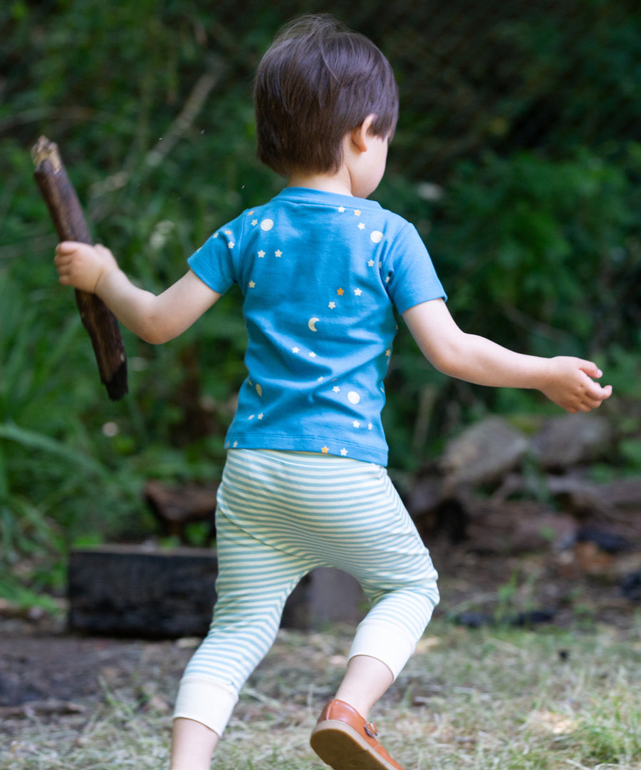 The back of the LGR Dawn Organic T-Shirt & Jogger Playset being worn by a child playing outside