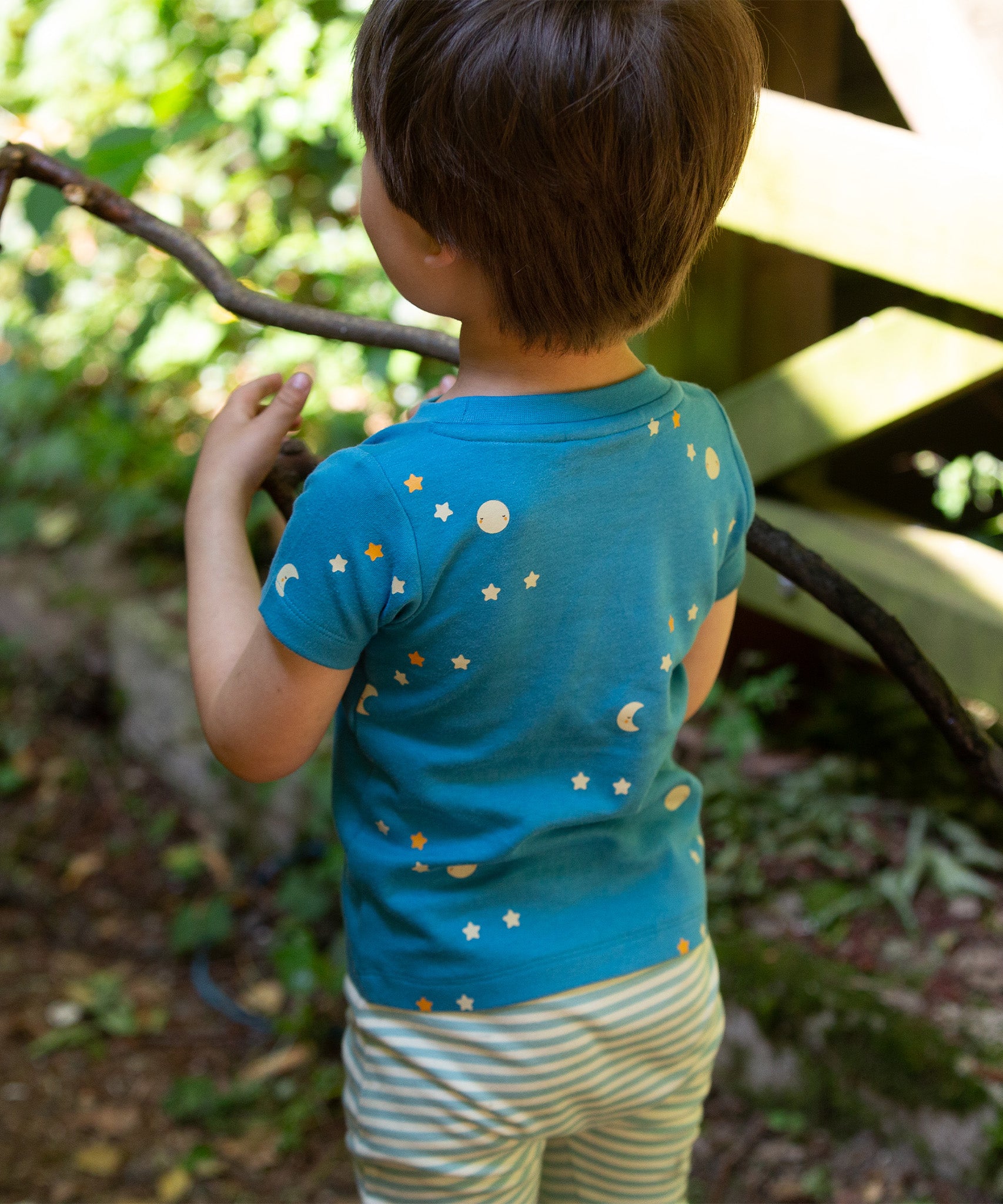 A close up of the moon and star print on the top of the LGR Dawn Organic T-Shirt & Jogger Playset