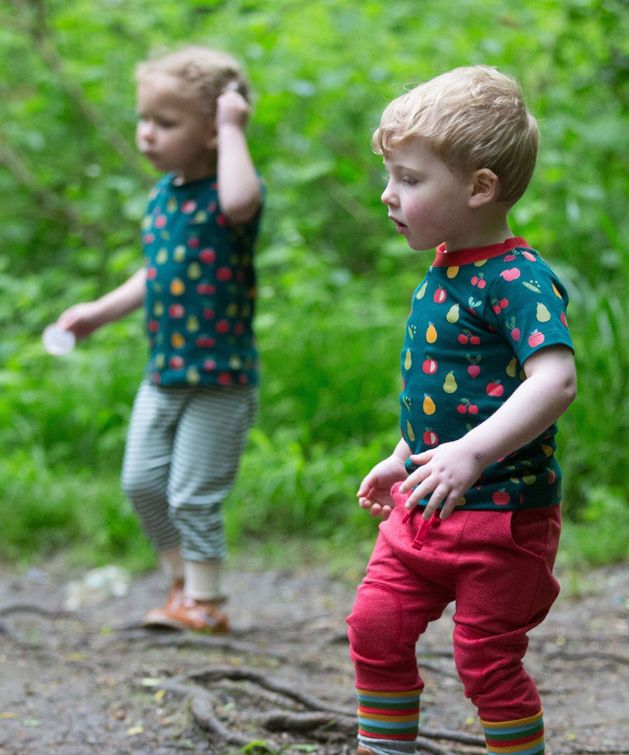 Two children playing outside, both wearing the LGR Vegetable Patch Short Sleeve T-Shirt