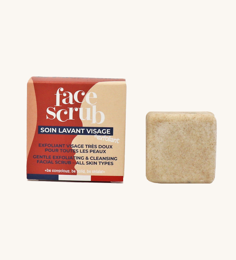 Lamazuna Solid Face Scrub Bar, gentle exfoliating and cleansing scrub bar for all skin types, next to its cardboard packaging on a cream background