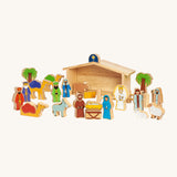 Lanka Kade Deluxe Nativity Set with wooden animal and people figures, and a wooden barn on a cream background. The figures include Mary, Joseph, Baby in a Manger, an Angel, the Three Kings, Shepard's, Sheep, Camels, Trees, a Donkey, a Bull and the Northern Star on a cream background 