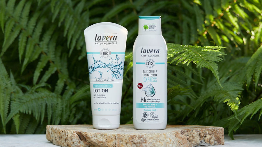 Two Lavera skincare products with leaves in the background