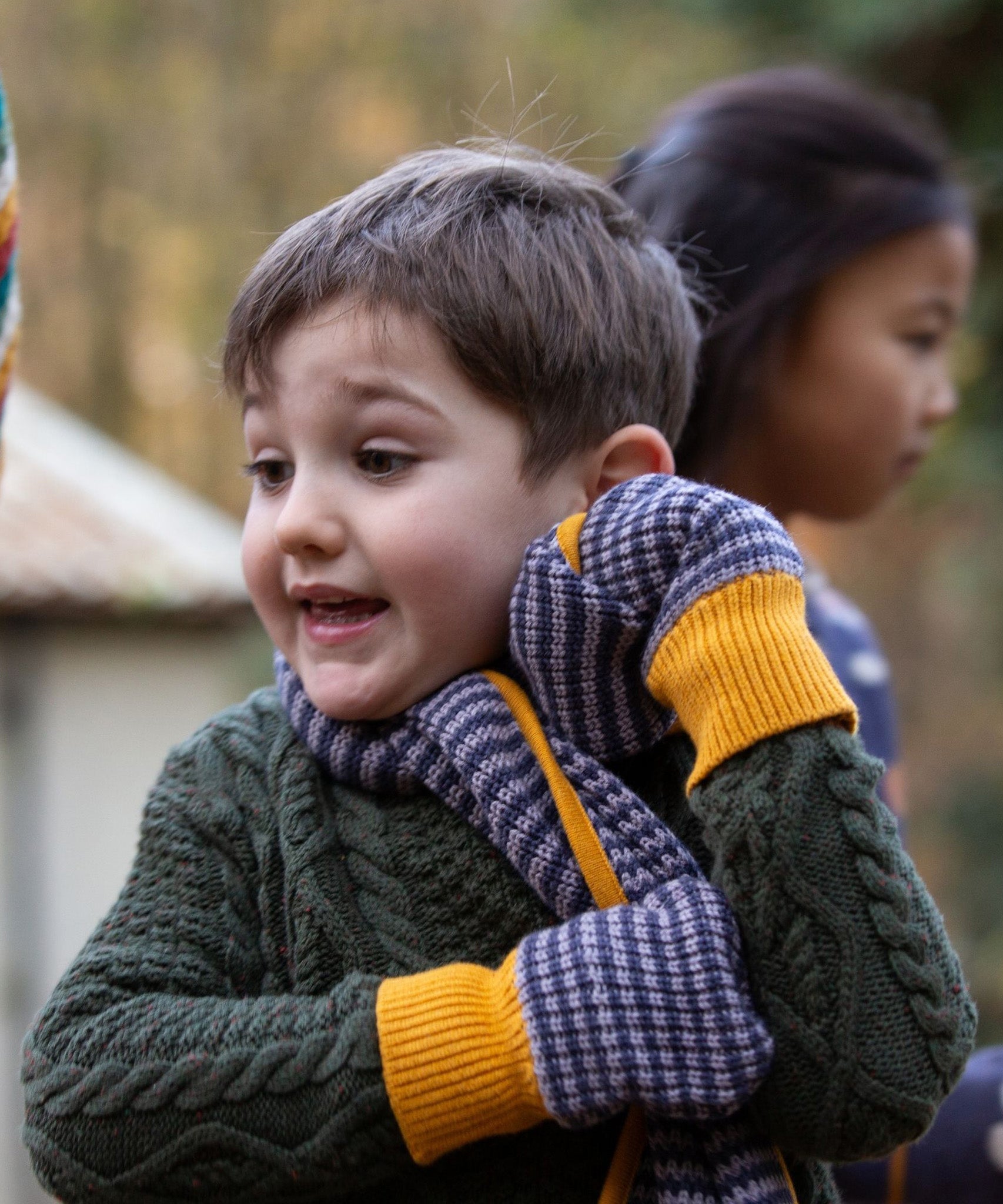 A closer look at the blue stripe and yellow detail on the Dreamy Blue Striped Knitted Mittens