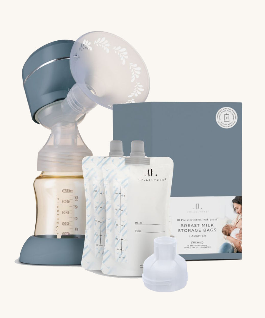 The Lola & Lykke Breast Pump Set, includes the Smart Electric Breast Pump, Milk storage bags and adapter. The box is also in the image next to the milk bags