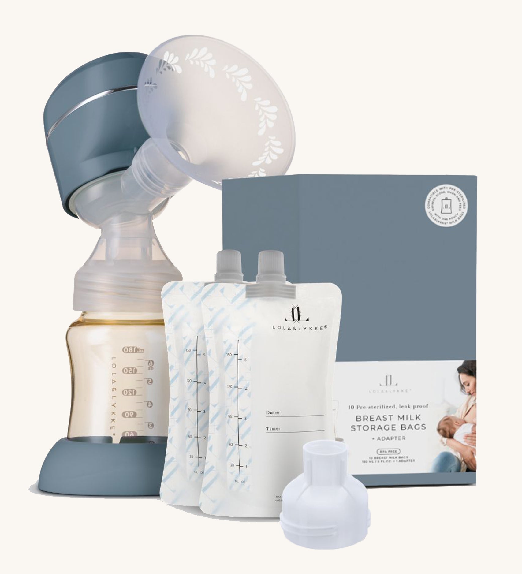 The Lola & Lykke Breast Pump Set, includes the Smart Electric Breast Pump, Milk storage bags and adapter. The box is also in the image next to the milk bags