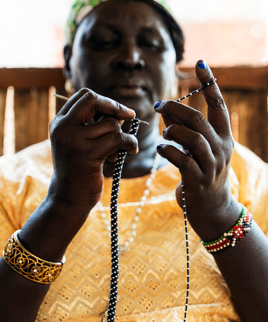 The intricate bead making skills of artisan bead crafting refugees