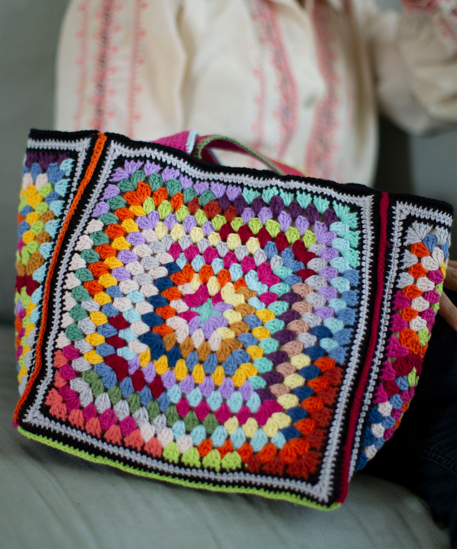 A close up view of the MADE51 Jedda Handmade Crochet Tote Bag, showing all the bold colours