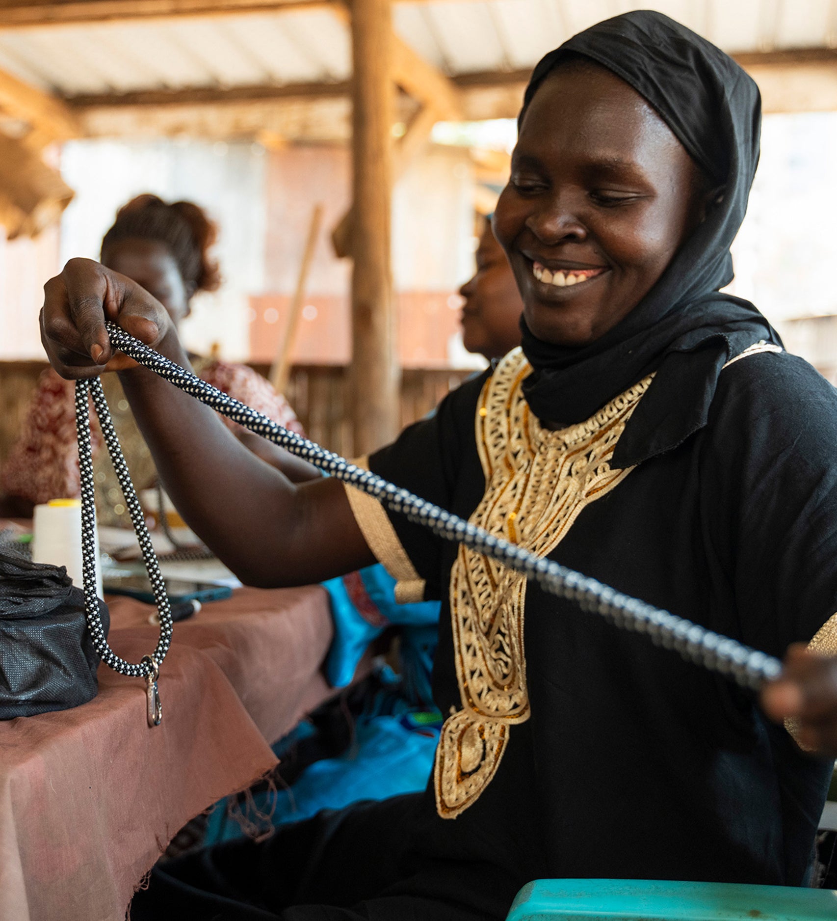 An artisan bead maker creating a beautiful beaded item