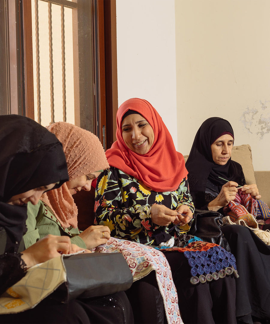 Oshana Tagrid - A group of refugee people hand-making beautiful blankets and bags