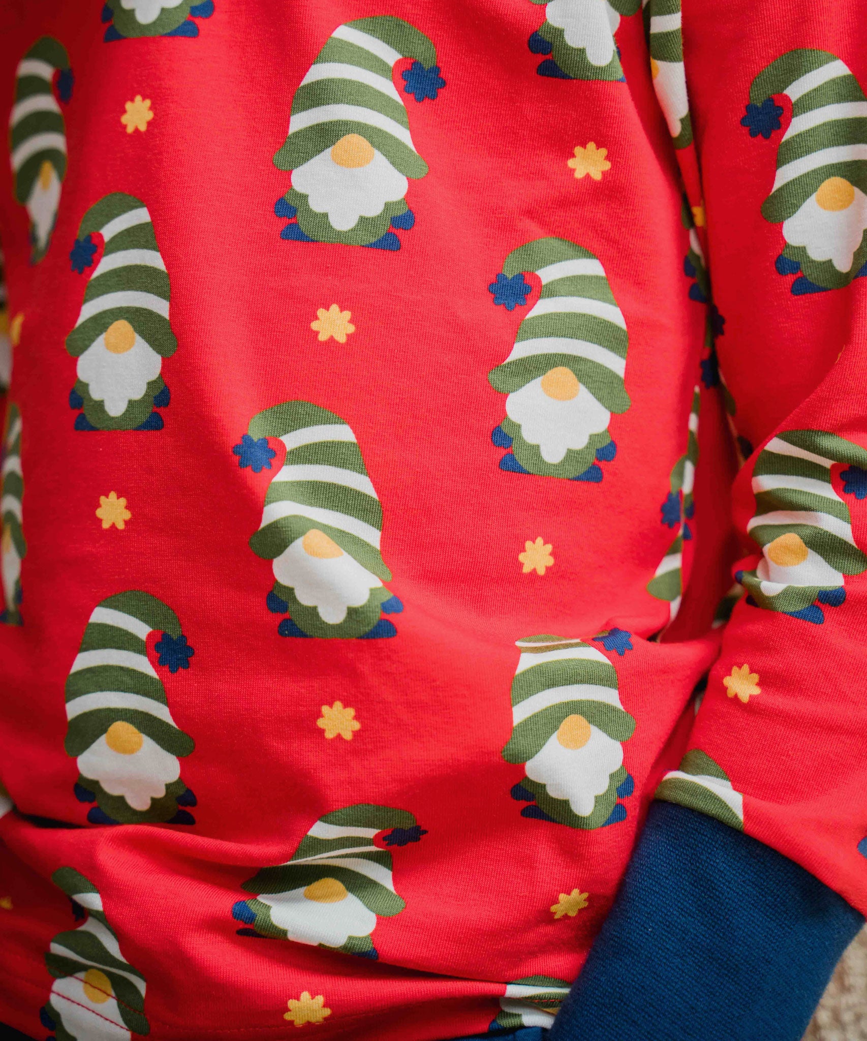 A super close up photo of the Maxomorra Swedish Santa print top showing the details on the print. 