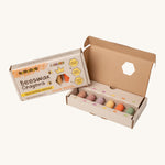 An opened packaging box showing the six pastel coloured junior beeswax crayons from Medenka. 