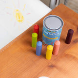 The Medenka natural beeswax bath crayons next to a bath. 