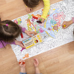 Children colouring in a large ocean scene on the floor, using the Medenka junior beeswax crayons.