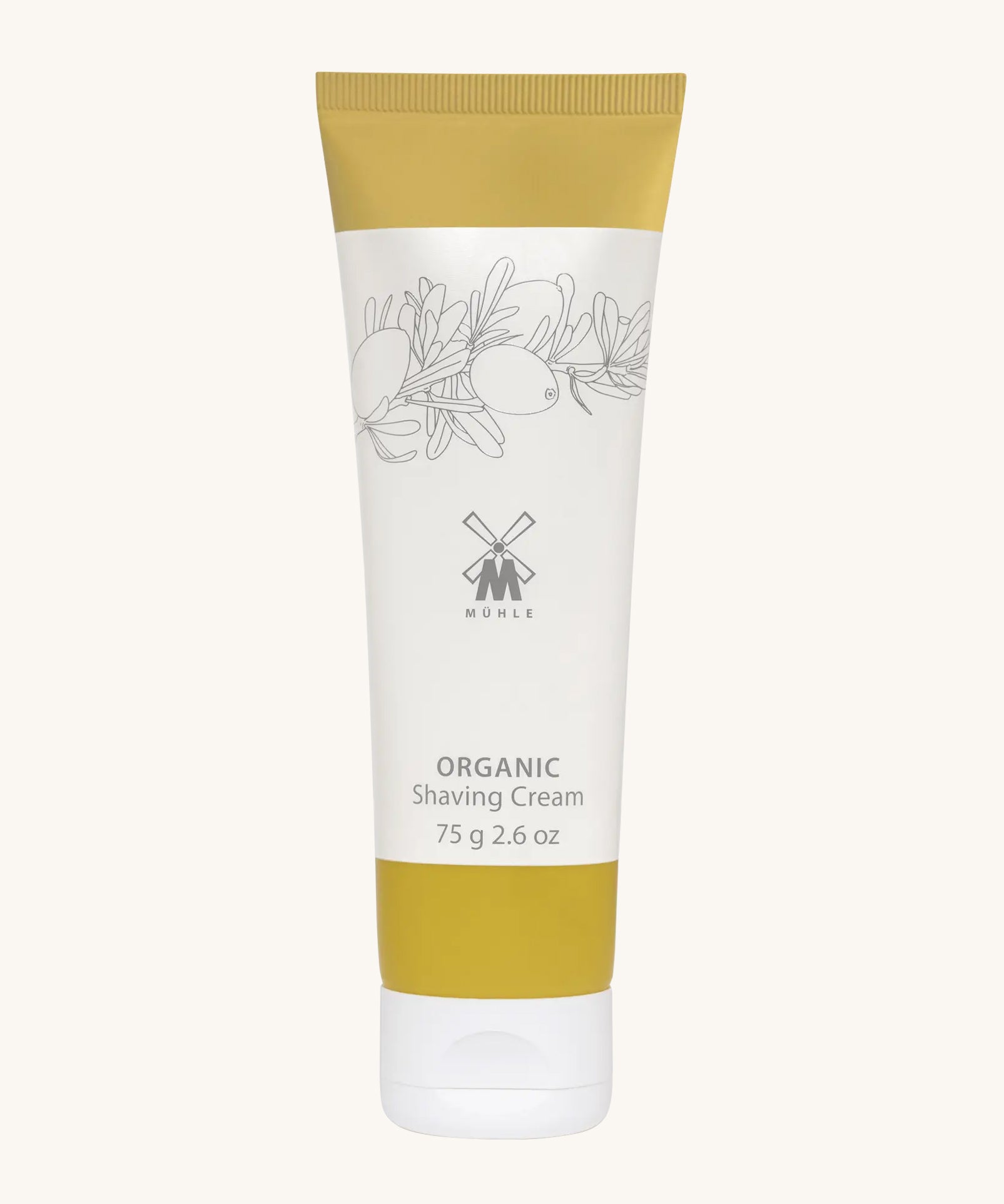 MÜHLE Organic Shaving Cream in a mustard and white tube with delicate olive branch design on the packaging and the Muhle logo in the middle. On a cream background