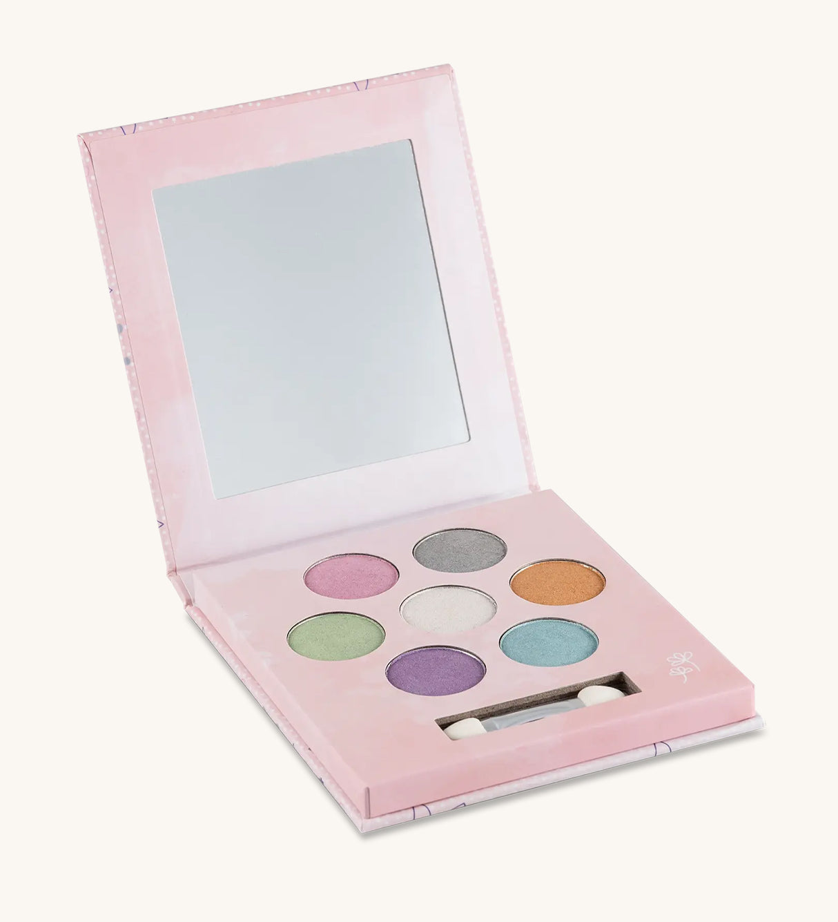 The inside of the Namaki Natural Eyeshadow Pallet - Fawn. The image shows the eye shadow colours which are pink, grey, gold, white, green, blue and purple, on a cream background