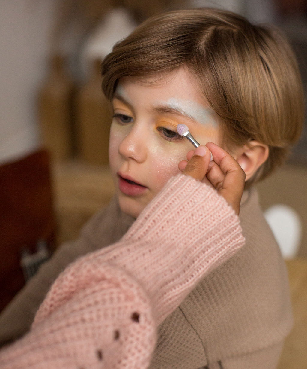 A child wearing the eyeshadow from the Namaki Natural Eyeshadow Pallet - Owl