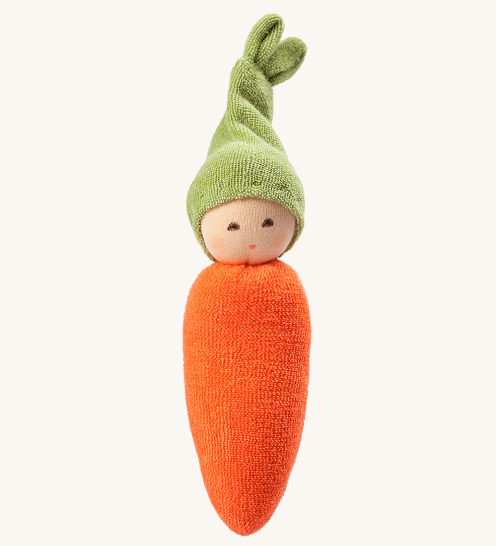 Nanchen Carrot Rattle Doll. A beautifully handcrafted rattle in the shape of an orange carrot, with a green hat. On a cream background