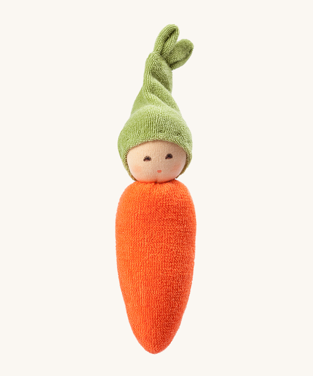 Nanchen Carrot Rattle Doll. A beautifully handcrafted rattle in the shape of an orange carrot, with a green hat. On a cream background