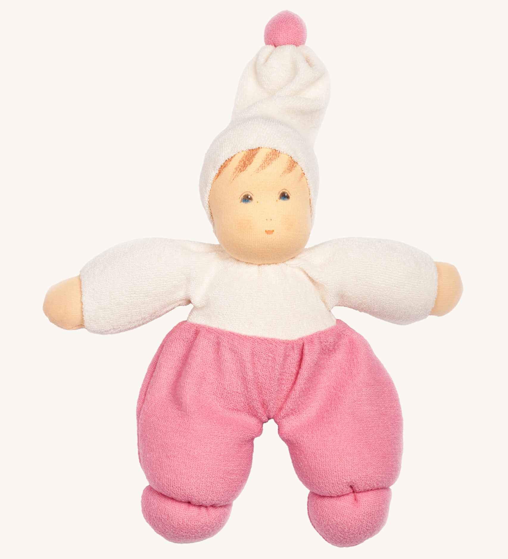 Nanchen Möpschen Doll - Pink. A soft and cuddly doll with pink trousers, a white top and white hat with a pink bobble on top