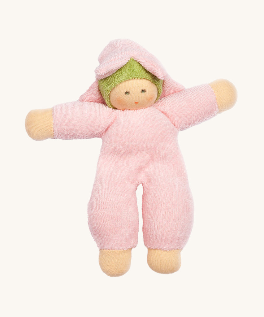 The Nanchen Flower Fairy Rattle Doll as a soft Pink terry material body, with a pretty pink terry material hat in the shape of a flower, and a green terry strip of fabric just under the hat