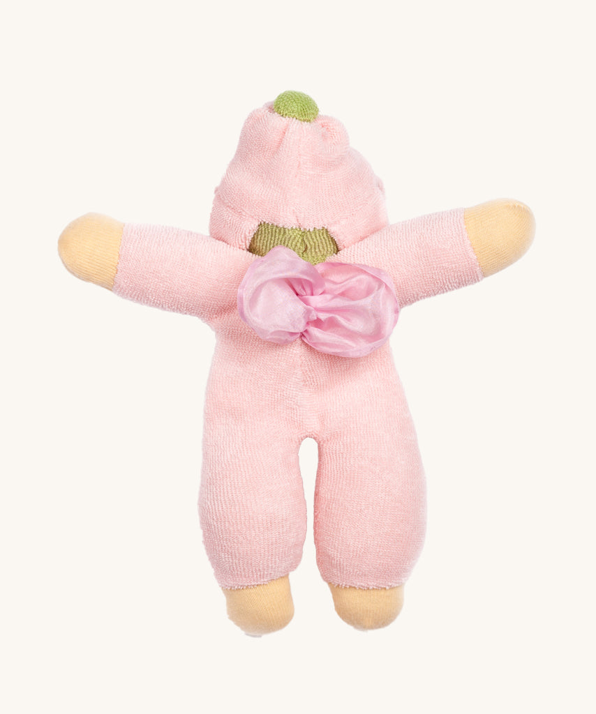 The back of the Nanchen Flower Fairy Rattle Doll with soft Pink terry material body, a pretty pink terry material hat in the shape of a flower, a green terry strip of fabric just under the hat, a silky pink wings on its back