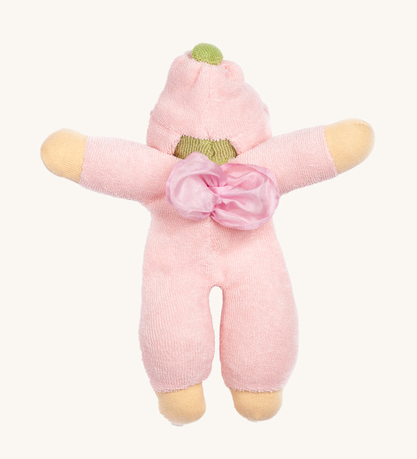 The back of the Nanchen Flower Fairy Rattle Doll with soft Pink terry material body, a pretty pink terry material hat in the shape of a flower, a green terry strip of fabric just under the hat, a silky pink wings on its back