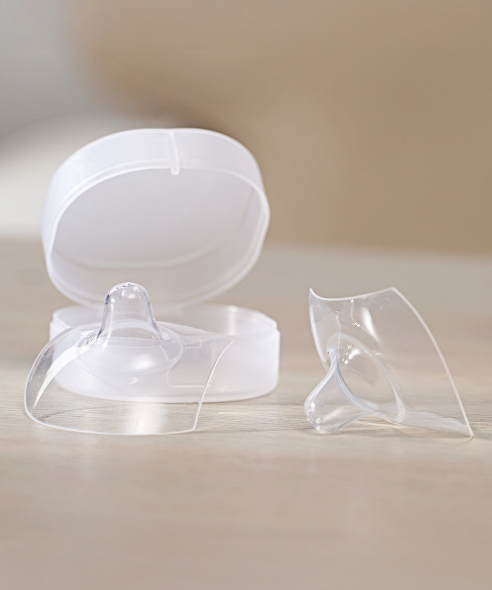 The Haakaa Silicone Nipple Shields with their storage case in the background