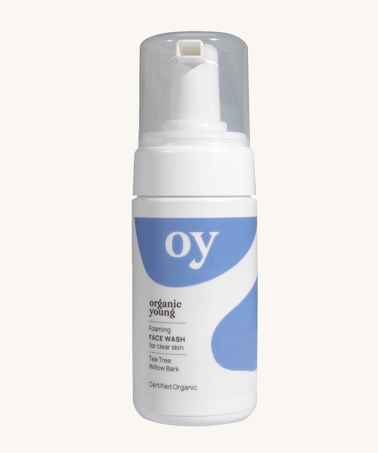 The Oy foaming face wash for clean skin, with tea tree and willow bark, on a cream background