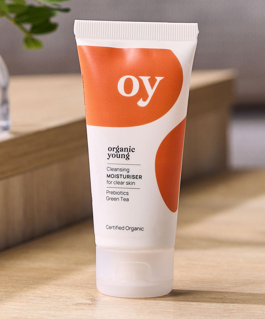 OY! Clear Skin Cleansing Moisturiser on a wooden table