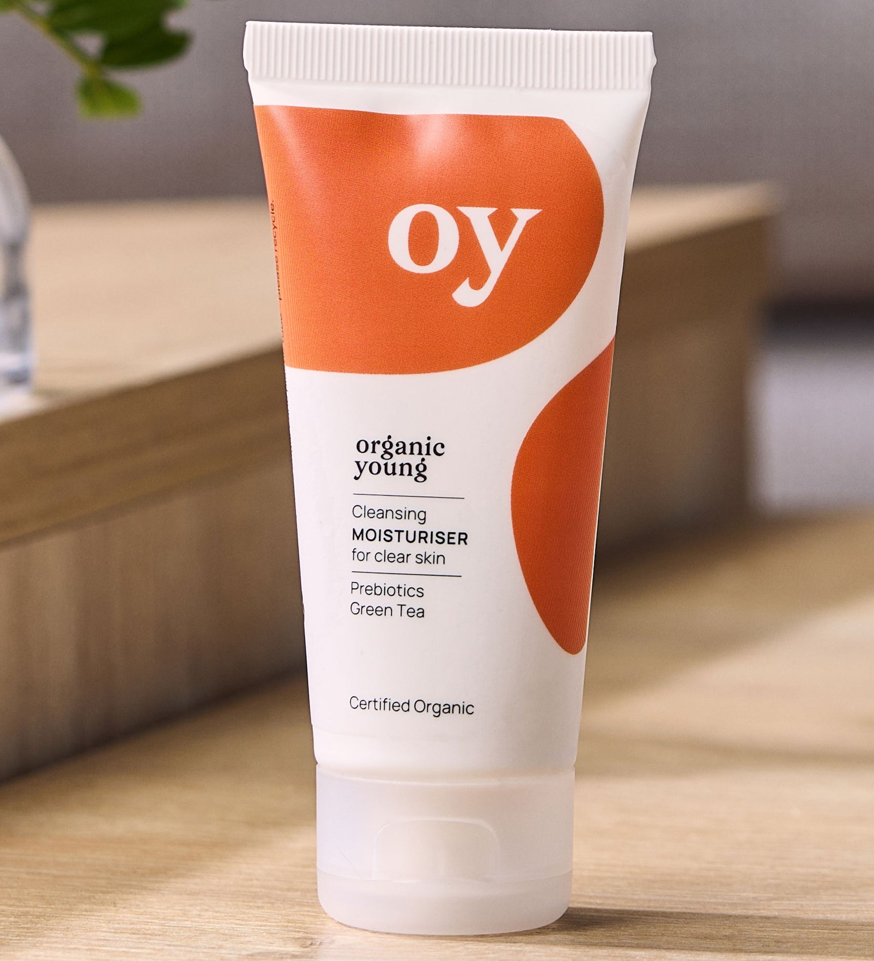 OY! Clear Skin Cleansing Moisturiser on a wooden table