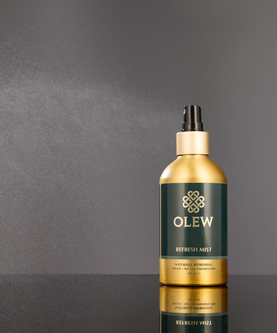 An image of the spray mist coming from the Curl Refresh Mist Bottle.