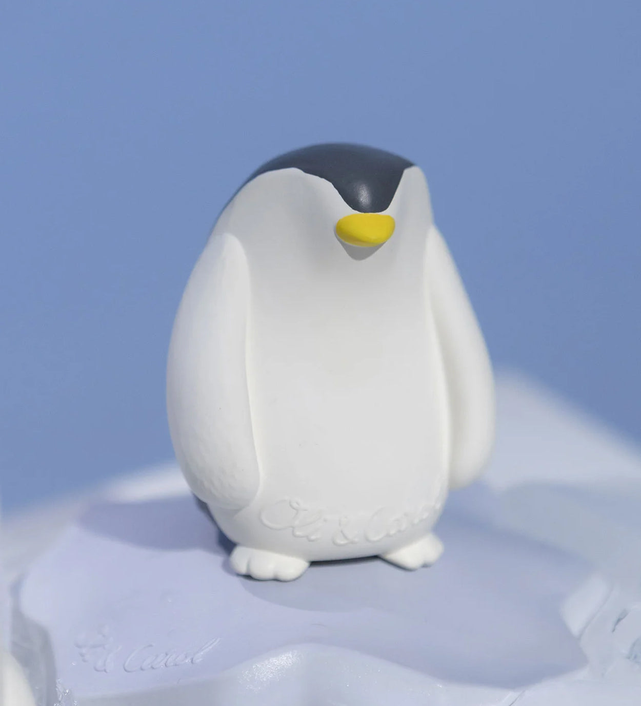 Oli & Carol Penguin Bath Toy Set on a blue background