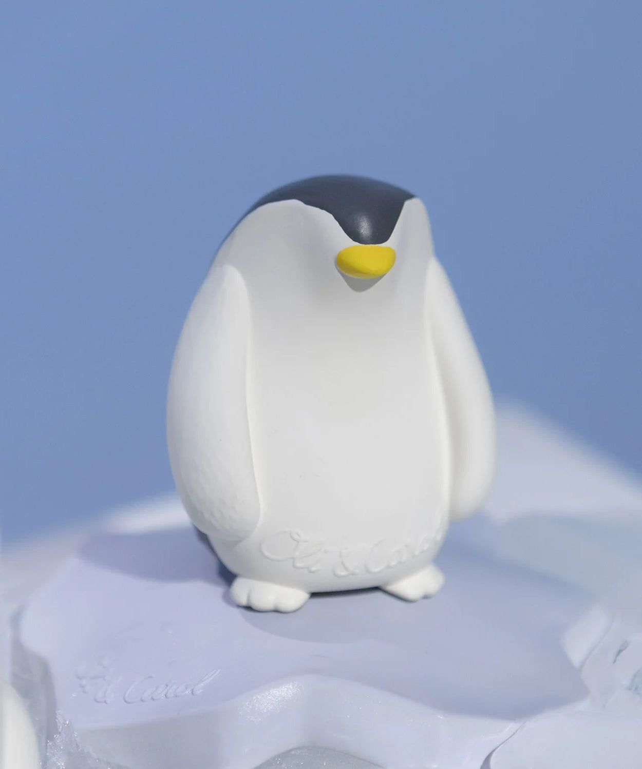 Oli & Carol Penguin Bath Toy Set on a blue background