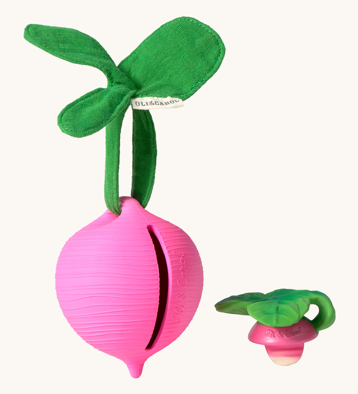 The Ramona Radish Pacifier Holder on a cream background. The image shows an Oli & Carol radish teething toy next to the holder, and the slot where the pacifier or teether can go inside the holder. The radish is textured and has a green muslin leaf attachment on the top to tie the holder to a pram handle, high chair etc.