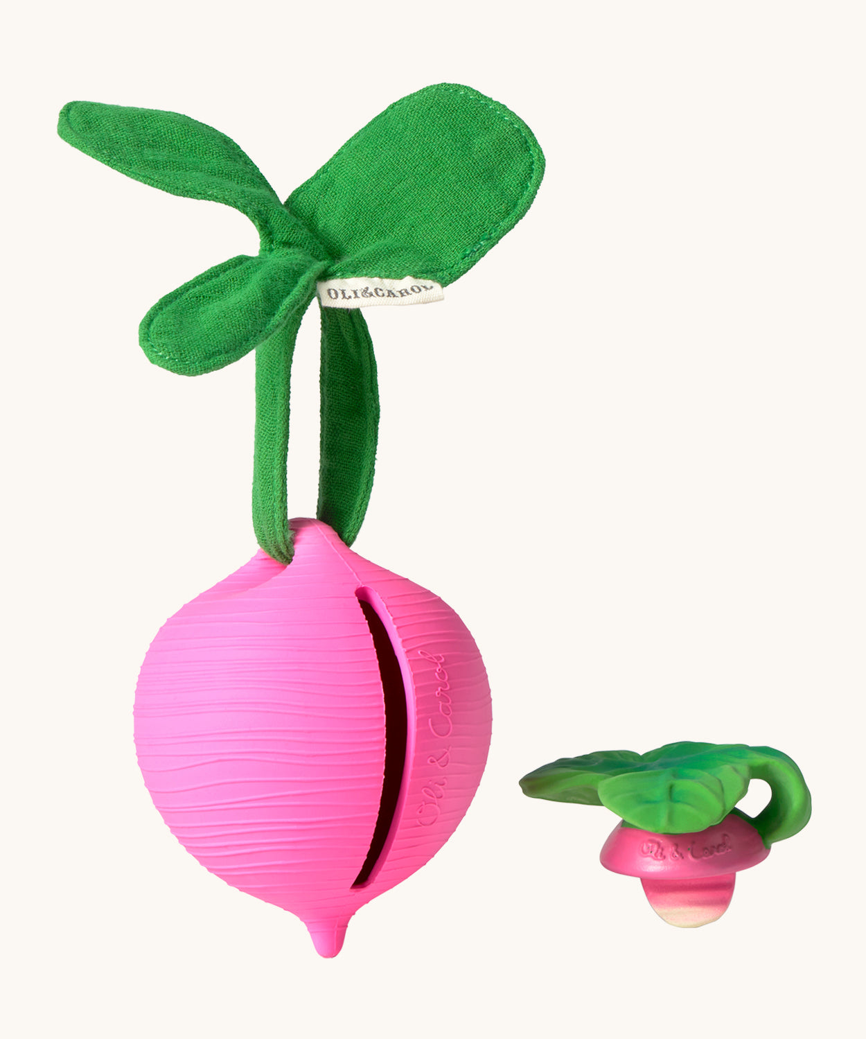 The Ramona Radish Pacifier Holder on a cream background. The image shows an Oli & Carol radish teething toy next to the holder, and the slot where the pacifier or teether can go inside the holder. The radish is textured and has a green muslin leaf attachment on the top to tie the holder to a pram handle, high chair etc.