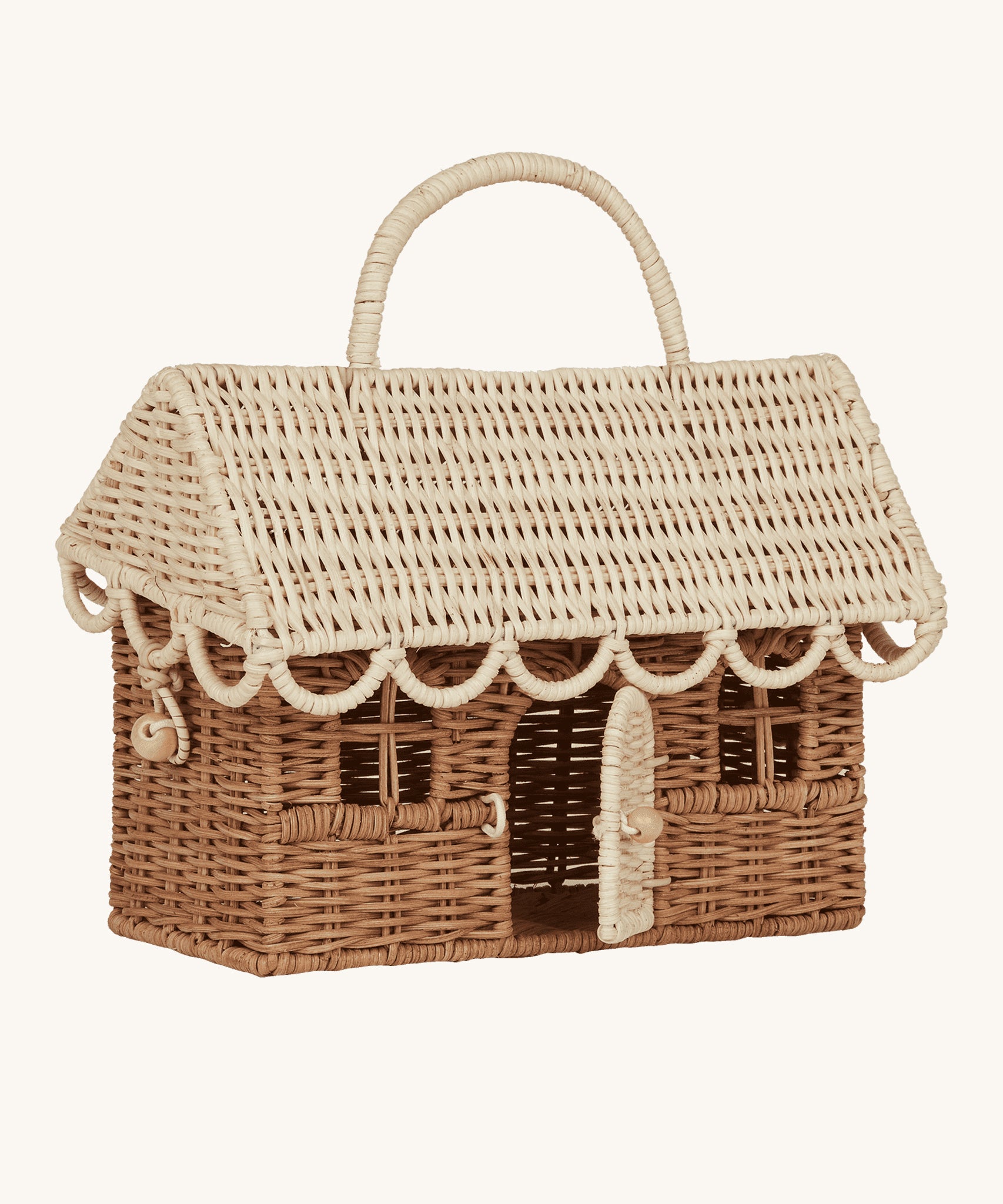 The Olli Ella Gingerbread House basket, with the door open. The image is taken side on to give a view of the wooden bead tie to keep the lid and the door closed. The image is on a cream background