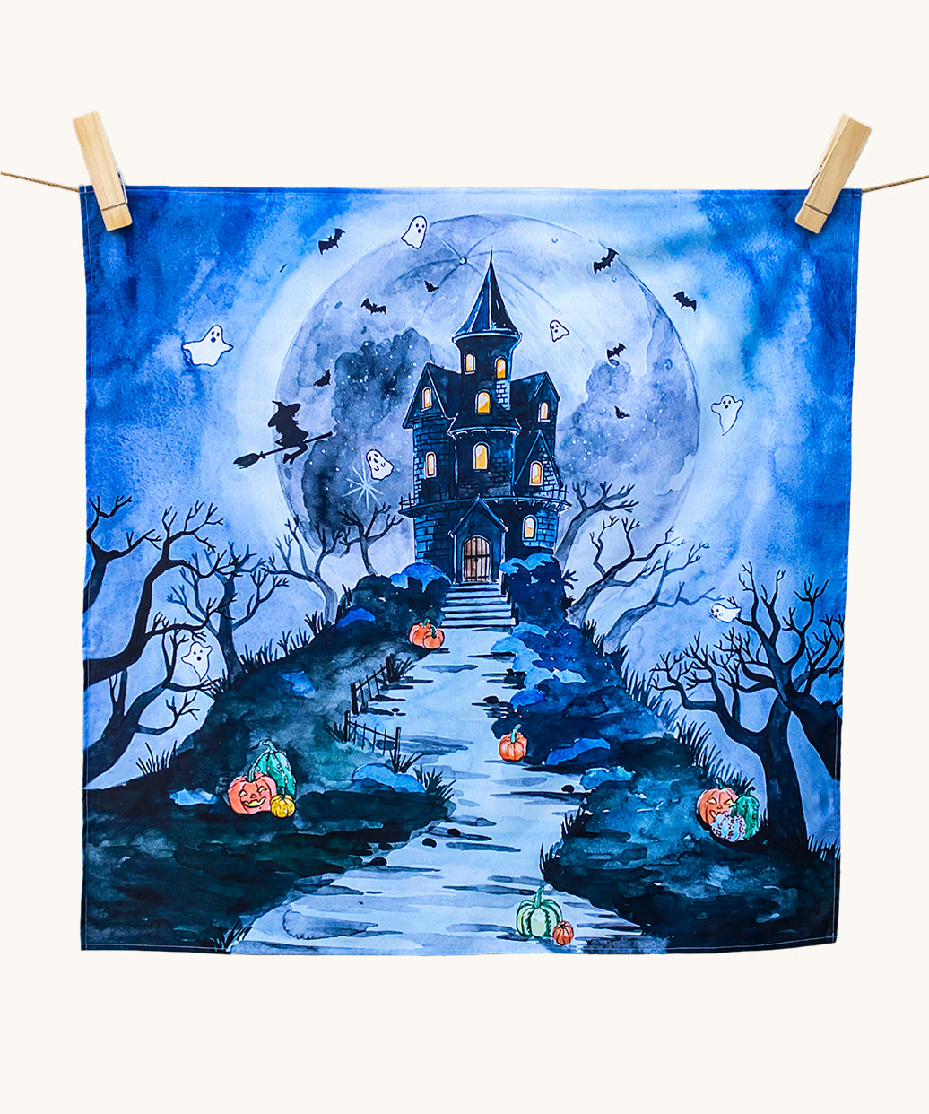 An organic play cloth with a fabulous spooky and Halloween print. A haunted manor on top of a steep hill side with stairs leading up to the door, has cute ghosts, bats and a witch circling around it. Behind the manor, is a large, full moon, and pumpkins outline the stairs and path to the manor