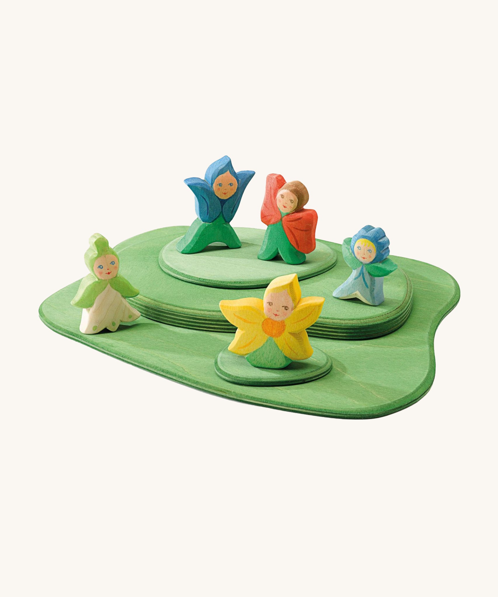 The Ostheimer Wooden Flower Children all playing together on the Ostheimer Wooden Meadow pieces. All of the Ostheimer Wooden Flower Children are handmade and hand crafted from natural wood