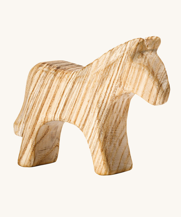 A beautifully hand crafted wooden horse figure, showing the beautiful natural wood grain