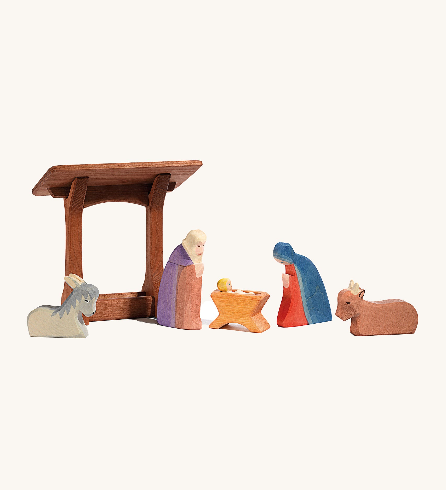 Ostheimer wooden manger toy with Christmas nativity figures and animals stood together. The perfect nativity scene