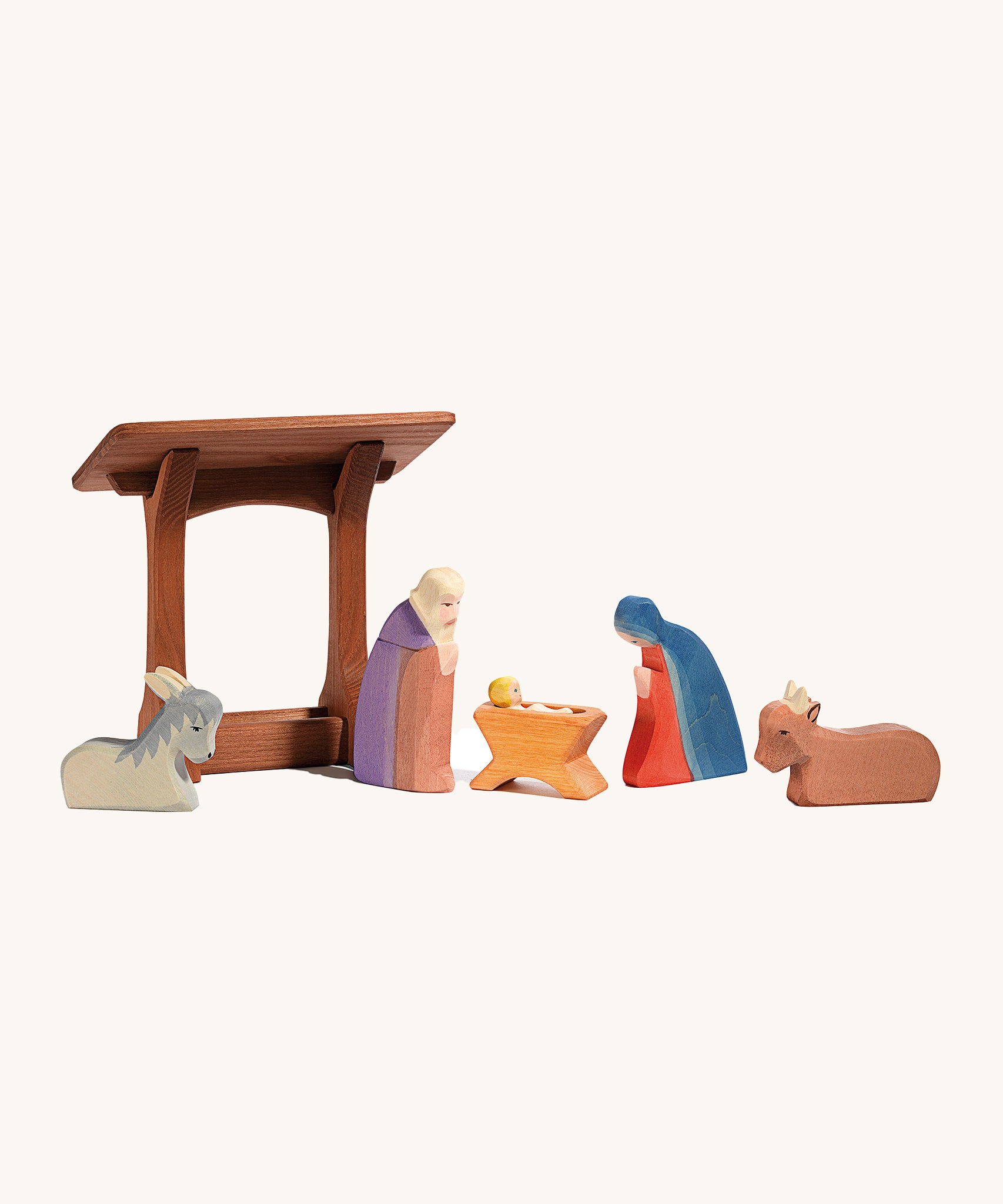 Ostheimer wooden manger toy with Christmas nativity figures and animals stood together. The perfect nativity scene