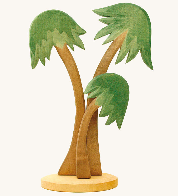 3 Ostheimer Palm Trees with a base support, with green leaves and light brown tree trunks. Set a nativity scene for Advent and Christmas or make your very own desert island with this group of three towering palm trees, swaying gently in the breeze