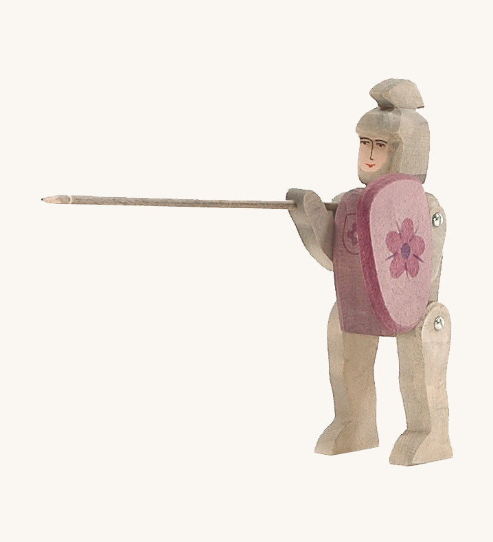 Hand made and hand painted Ostheimer Red Riding Knight, with grey armour and a purple-red shield with a flower coat of arms