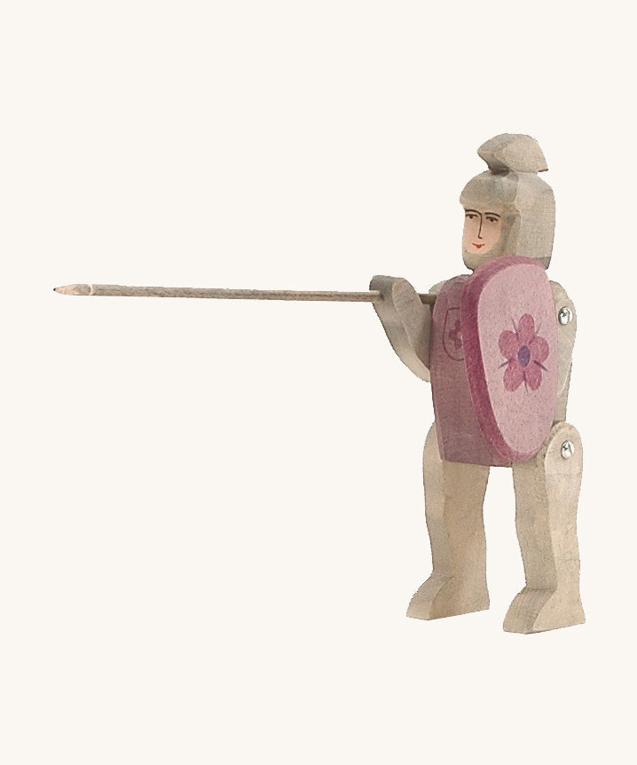 Hand made and hand painted Ostheimer Red Riding Knight, with grey armour and a purple-red shield with a flower coat of arms