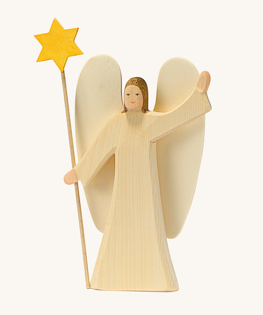 Ostheimer Angel With Star. This festive angel has two large wings on its back, and the star is being held on top of a long thin piece of wood